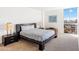 Bright bedroom with a large window offering city views, complemented by modern furnishings at 2323 N Central Ave # 1902, Phoenix, AZ 85004