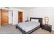 Well-lit bedroom featuring modern decor, wood doors, and a serene atmosphere at 2323 N Central Ave # 1902, Phoenix, AZ 85004