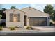 Charming single-story home featuring desert landscaping, and a two-car garage at 24369 W La Salle St, Buckeye, AZ 85326