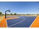 A full basketball court with professional surfaces, multiple hoops, and lush landscaping at 3423 E Superior Rd, San Tan Valley, AZ 85143
