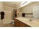 Bathroom featuring a shower-tub combo, spacious vanity and large mirror at 3423 E Superior Rd, San Tan Valley, AZ 85143