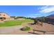 A community park with a playground, walking paths, lush lawns, and surrounding homes for Gathering fun at 3423 E Superior Rd, San Tan Valley, AZ 85143