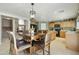 A kitchen with an island, breakfast bar, tile floors, and wood cabinets at 3423 E Superior Rd, San Tan Valley, AZ 85143