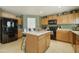 Well-equipped kitchen with stainless steel appliances, island, and ample counter space at 3423 E Superior Rd, San Tan Valley, AZ 85143