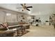 Well-lit living room featuring a comfortable sectional sofa and a large entertainment area at 3423 E Superior Rd, San Tan Valley, AZ 85143
