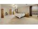 A spacious main bedroom featuring neutral walls, carpet, and ensuite bathroom at 3423 E Superior Rd, San Tan Valley, AZ 85143