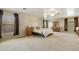 A spacious main bedroom featuring neutral walls, carpet, and ensuite bathroom at 3423 E Superior Rd, San Tan Valley, AZ 85143