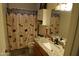 Bathroom features a granite countertop vanity and unique decor at 3708 W Redfield Rd, Phoenix, AZ 85053