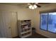 Bedroom with a ceiling fan and a small cabinet at 3708 W Redfield Rd, Phoenix, AZ 85053