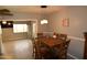 Bright dining room features a wooden table with seating for six and modern hanging lights at 3708 W Redfield Rd, Phoenix, AZ 85053