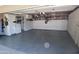 Spacious garage with finished floors, built in cabinets, and overhead storage for efficient organization at 3708 W Redfield Rd, Phoenix, AZ 85053