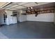 Well-organized garage with epoxy floors, built-in shelving, and storage solutions for optimal organization at 3708 W Redfield Rd, Phoenix, AZ 85053