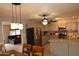 Modern kitchen featuring stainless steel appliances, gray cabinets, and granite countertops at 3708 W Redfield Rd, Phoenix, AZ 85053