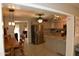 Open kitchen features stainless steel appliances, granite countertops, and modern hanging lights at 3708 W Redfield Rd, Phoenix, AZ 85053