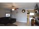 This living room with a ceiling fan provides a cozy space for relaxation at 3708 W Redfield Rd, Phoenix, AZ 85053