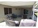 Inviting covered patio features comfortable seating, a fire pit, and a convenient outdoor space for relaxation at 3708 W Redfield Rd, Phoenix, AZ 85053