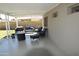 Cozy covered patio with sleek flooring, comfortable seating, and a fire pit for outdoor enjoyment at 3708 W Redfield Rd, Phoenix, AZ 85053