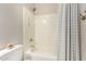 Clean bathroom showcases shower with showerhead and curtain, toilet and neutral color palette at 3765 E Del Rio St, Gilbert, AZ 85295