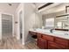 This bathroom features a vanity with a make up mirror, vanity stool, and walk in toilet room at 3765 E Del Rio St, Gilbert, AZ 85295
