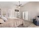 This bedroom features a ceiling fan, closet, and neutral colors at 3765 E Del Rio St, Gilbert, AZ 85295