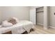Cozy bedroom featuring a closet, neutral colors, and plush bedding for relaxation at 3765 E Del Rio St, Gilbert, AZ 85295