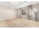 Bonus room features wood floors, neutral walls, lighting equipment, and a window at 3765 E Del Rio St, Gilbert, AZ 85295