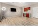 Bonus room features wood floors, tv, wet bar, lighting equipment, and neutral walls at 3765 E Del Rio St, Gilbert, AZ 85295