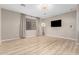 Bonus room with wood floors, neutral walls, tv and lighting equipment at 3765 E Del Rio St, Gilbert, AZ 85295