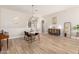 Open concept dining room with modern chandelier and lots of space for Gathering gatherings at 3765 E Del Rio St, Gilbert, AZ 85295