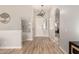 Inviting entryway featuring wood-look tile flooring, modern light fixtures, and neutral paint at 3765 E Del Rio St, Gilbert, AZ 85295