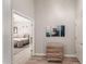 Hallway with modern decor leading to a bedroom; featuring light-colored walls and tile floors at 3765 E Del Rio St, Gilbert, AZ 85295