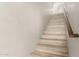 Staircase features wood stairs and white walls leading to the home's upper level at 3765 E Del Rio St, Gilbert, AZ 85295