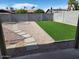 Backyard featuring artificial turf and a gravel area with a concrete slab path at 4026 W Saint John Rd, Glendale, AZ 85308