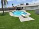 Backyard with a diving board, turf, and surrounding fencing at 4026 W Saint John Rd, Glendale, AZ 85308
