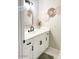 Bathroom featuring a vanity with white countertop, modern fixtures, and decor at 4026 W Saint John Rd, Glendale, AZ 85308