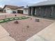 The exterior showcases desert landscaping with artificial turf and rock features at 4026 W Saint John Rd, Glendale, AZ 85308