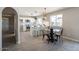 Bright eat-in kitchen with modern white cabinets, stainless steel appliances, and a large island at 4026 W Saint John Rd, Glendale, AZ 85308