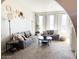 Spacious living room featuring comfortable seating, large windows, and natural light at 4026 W Saint John Rd, Glendale, AZ 85308