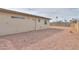 A very low maintenance backyard features gravel landscaping and access door at 406 E Saguaro St, Casa Grande, AZ 85122