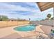 A beautiful backyard pool featuring updated concrete, coping, and landscaping at 406 E Saguaro St, Casa Grande, AZ 85122