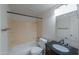 A standard bathroom with a shower/tub combo and dark wood vanity at 406 E Saguaro St, Casa Grande, AZ 85122