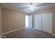 The spacious bedroom is complete with a ceiling fan and an oversized closet at 406 E Saguaro St, Casa Grande, AZ 85122