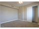 A simple bedroom with carpet flooring, neutral walls and standard closet at 406 E Saguaro St, Casa Grande, AZ 85122