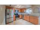 Updated kitchen featuring stainless steel appliances, granite countertops, tiled backsplash and new cabinets at 406 E Saguaro St, Casa Grande, AZ 85122