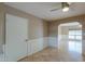 Bright living room featuring neutral walls, a ceiling fan and archway to another room at 406 E Saguaro St, Casa Grande, AZ 85122
