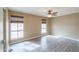 Living area with two large windows, wood floors and a ceiling fan at 406 E Saguaro St, Casa Grande, AZ 85122