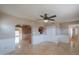 The living room opens to the kitchen with tile floors and neutral walls at 406 E Saguaro St, Casa Grande, AZ 85122