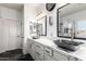 Stylish bathroom featuring double sinks, quartz countertop and modern fixtures at 44560 W Copper Trl, Maricopa, AZ 85139
