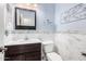 Stylish bathroom featuring vanity, framed mirror, and modern fixtures at 44560 W Copper Trl, Maricopa, AZ 85139