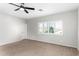Bedroom featuring neutral walls, carpet floors, and a window for natural light at 44560 W Copper Trl, Maricopa, AZ 85139
